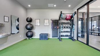 Fitness center with a treadmill and weights